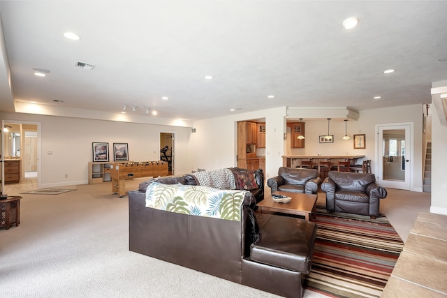 13615 N Riverbluff Ln, Spokane, WA 99208 - living area with light carpet, recessed lighting, visible vents, and baseboards