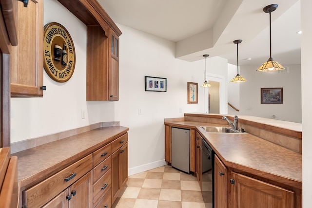 13615 N Riverbluff Ln, Spokane, WA 99208 - kitchen with black dishwasher, dishwasher, a sink, brown cabinets, and pendant lighting