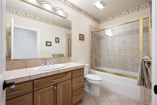 13615 N Riverbluff Ln, Spokane, WA 99208 - bathroom featuring tile patterned flooring, enclosed tub / shower combo, vanity, and toilet