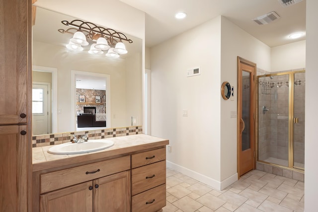 13615 N Riverbluff Ln, Spokane, WA 99208 - bathroom with a shower stall, tasteful backsplash, ensuite bath, and visible vents