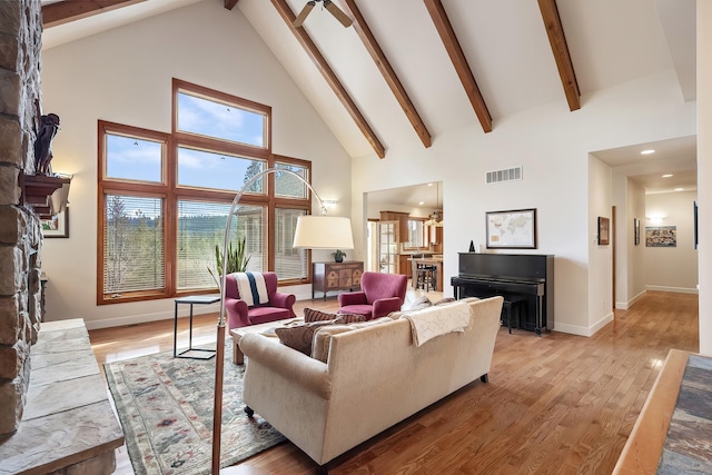 13615 N Riverbluff Ln, Spokane, WA 99208 - living area with light wood-style flooring, visible vents, and a stone fireplace