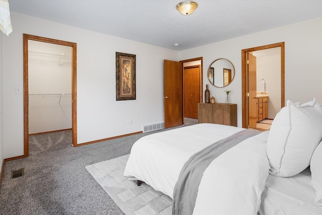 2603 S Sunnybrook Ln, Spokane, WA 99037 - bedroom featuring a walk in closet, carpet, a closet, and ensuite bathroom