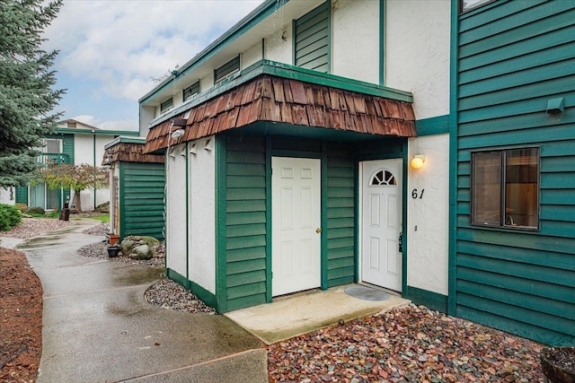 2121 E Upriver Dr Unit # 61, Spokane, WA 99207 - entrance to property featuring stucco siding