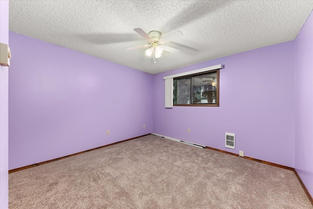 2121 E Upriver Dr Unit # 61, Spokane, WA 99207 - empty room with visible vents, baseboards, a ceiling fan, a textured ceiling, and carpet floors