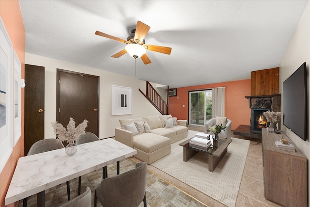 2121 E Upriver Dr Unit # 61, Spokane, WA 99207 - living room featuring a stone fireplace, stairway, and a ceiling fan
