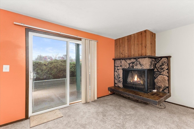 2121 E Upriver Dr Unit # 61, Spokane, WA 99207 - carpeted living area with a fireplace and baseboards