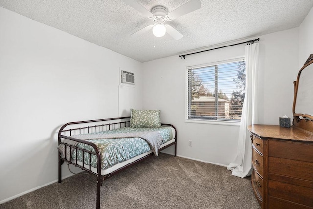 carpeted bedroom featuring a textured ceiling, baseboards, and a ceiling fan