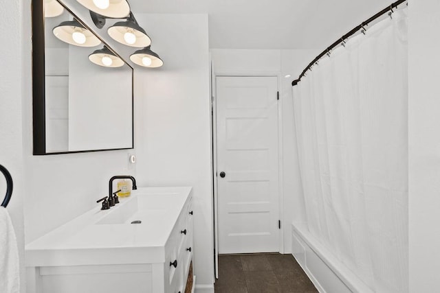 bathroom featuring shower / bath combo and vanity