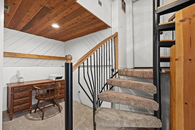 stairway with wooden ceiling, carpet flooring, and visible vents
