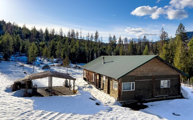 2467 Widow Rd Unit D, Colville, WA 99114 - snowy aerial view featuring a forest view