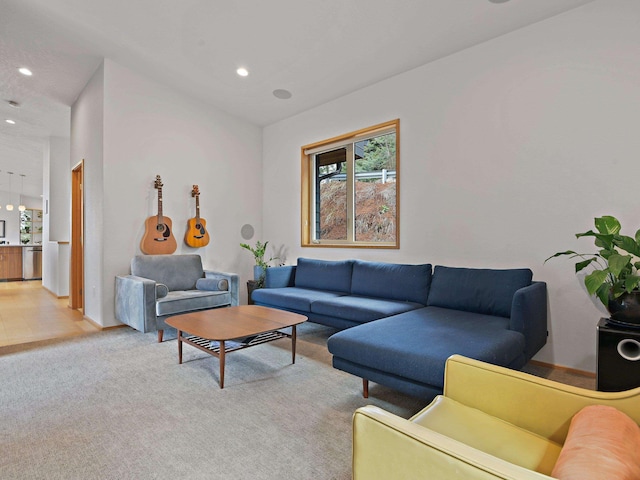living area featuring recessed lighting and light colored carpet