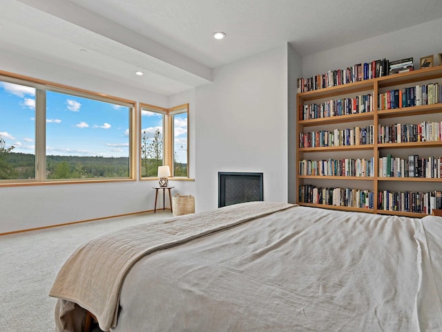 bedroom with carpet flooring, baseboards, recessed lighting, and a fireplace