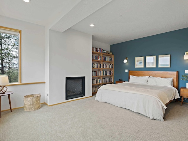 bedroom with carpet floors, baseboards, recessed lighting, and a fireplace