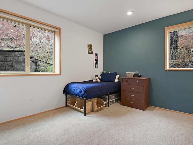 bedroom featuring recessed lighting, multiple windows, baseboards, and carpet floors