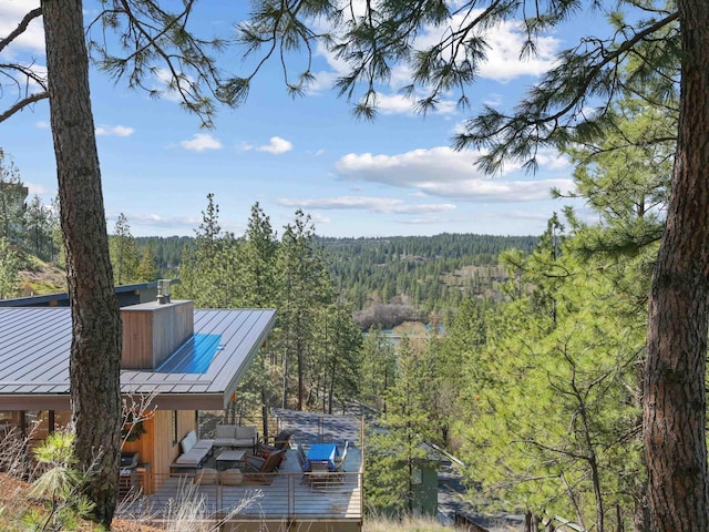exterior space with a forest view
