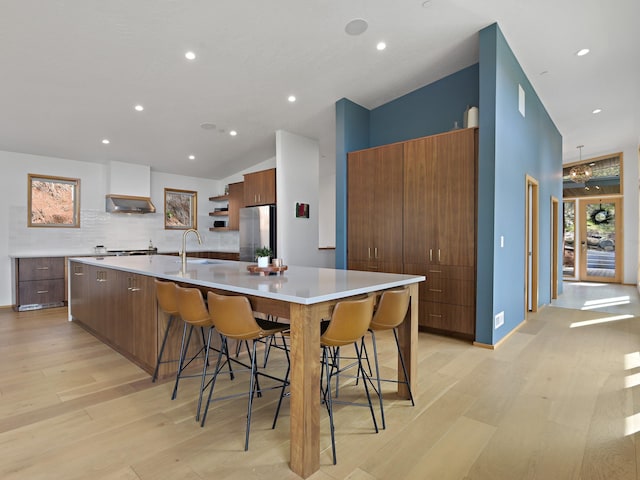 kitchen featuring a sink, open shelves, modern cabinets, and stainless steel appliances