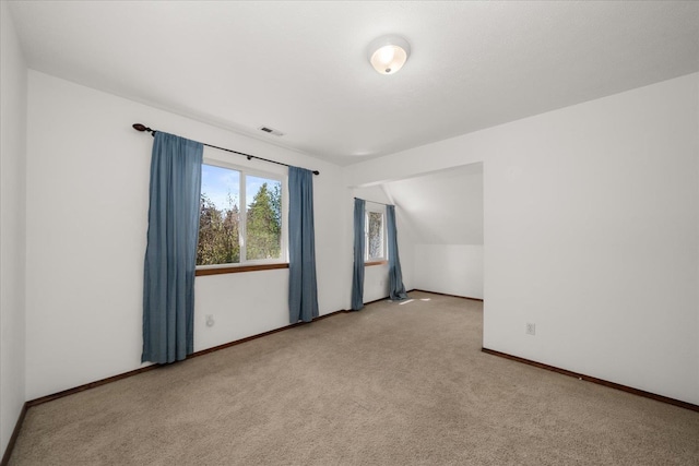 bonus room with carpet, visible vents, and baseboards