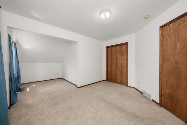 bonus room featuring visible vents, baseboards, and carpet floors