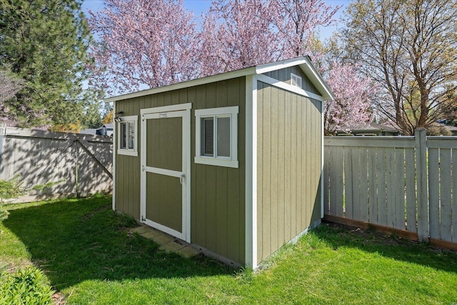 view of shed featuring a fenced backyard