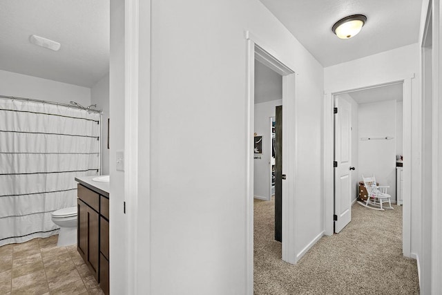 corridor featuring baseboards
