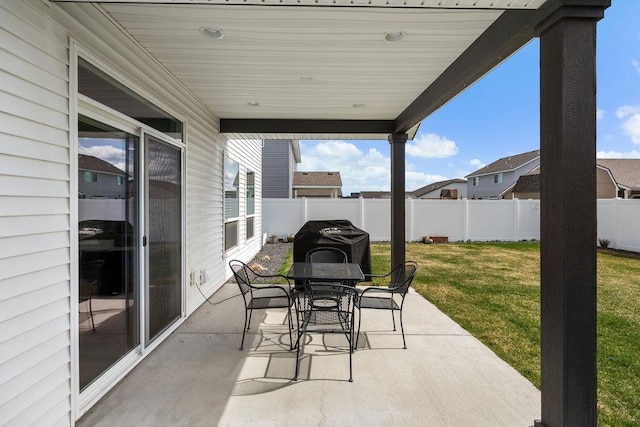 view of patio / terrace featuring outdoor dining area, a fenced backyard, and area for grilling