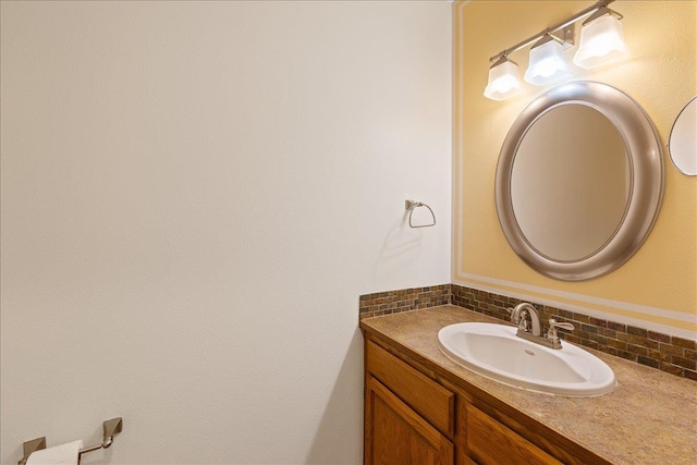 bathroom featuring decorative backsplash and vanity