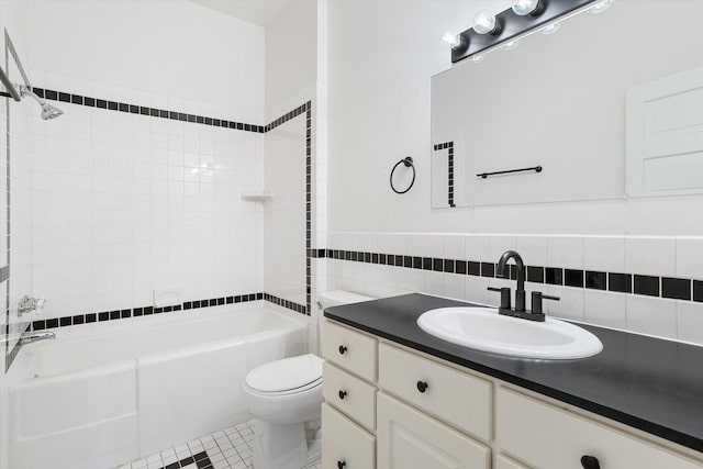 full bath with tile walls, toilet, vanity, shower / tub combination, and tile patterned flooring
