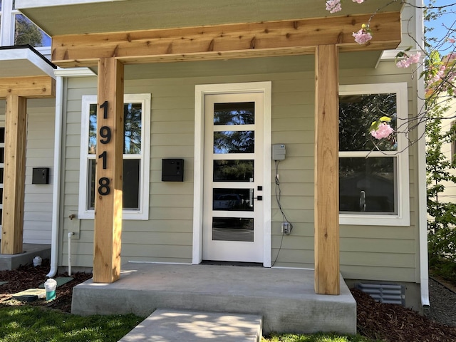 doorway to property featuring a porch