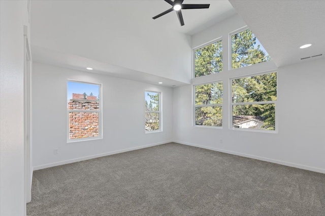 carpeted spare room featuring baseboards, recessed lighting, visible vents, and ceiling fan