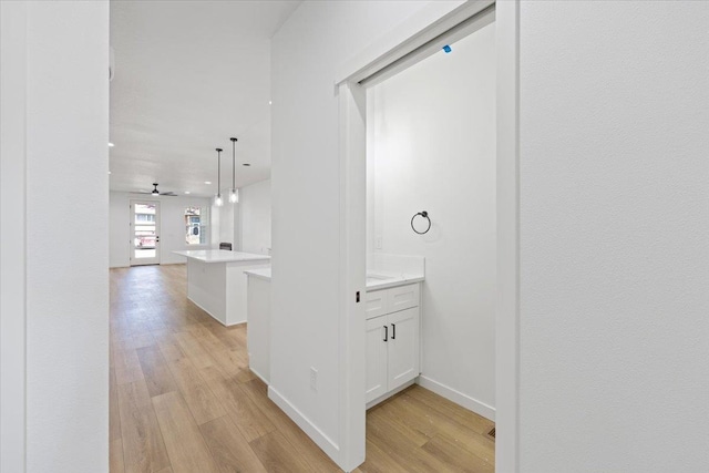1920 E 37th Ave, Spokane, WA 99203 - hallway with baseboards and light wood-type flooring