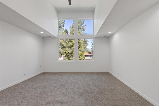 1920 E 37th Ave, Spokane, WA 99203 - unfurnished room with carpet flooring, a towering ceiling, and recessed lighting