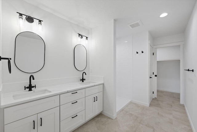 1920 E 37th Ave, Spokane, WA 99203 - full bathroom with baseboards, double vanity, and a sink