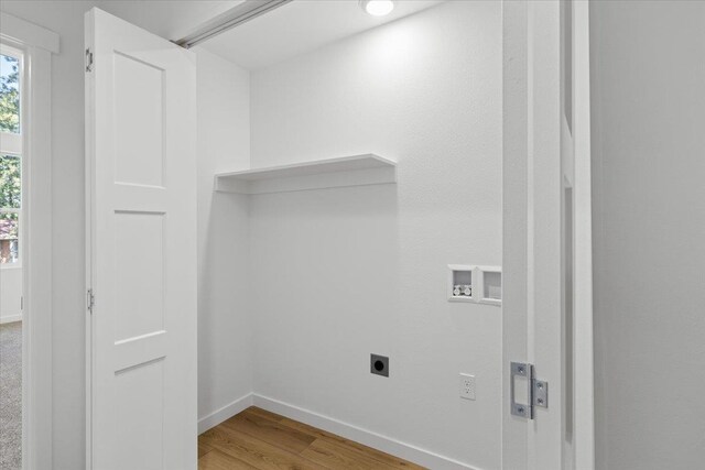 1920 E 37th Ave, Spokane, WA 99203 - laundry area featuring hookup for an electric dryer, hookup for a washing machine, wood finished floors, and baseboards