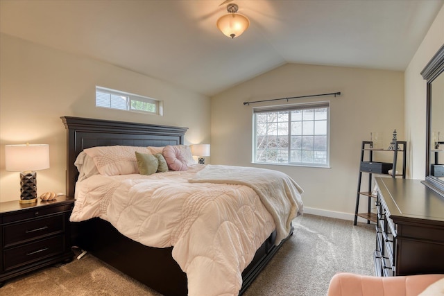bedroom with baseboards, lofted ceiling, multiple windows, and carpet