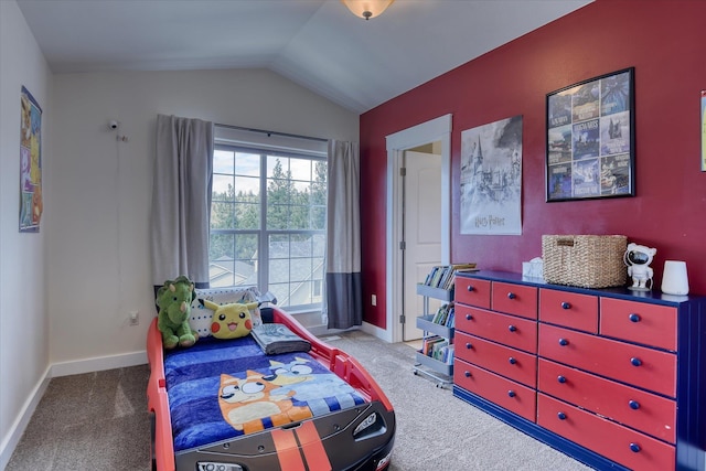 carpeted bedroom featuring baseboards and vaulted ceiling