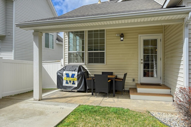 view of patio / terrace featuring grilling area, entry steps, and fence