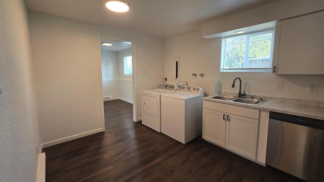 washroom featuring dark wood-style flooring, separate washer and dryer, a wealth of natural light, laundry area, and a sink