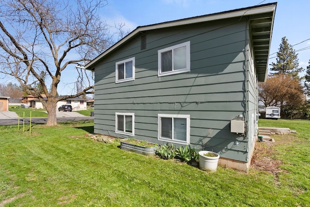rear view of house with a yard