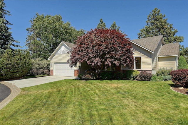 4420 E 51st Ln, Spokane, WA 99223 - view of front of property featuring driveway, a front yard, roof with shingles, and a garage