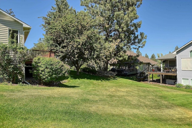 4420 E 51st Ln, Spokane, WA 99223 - view of grassy yard featuring a deck