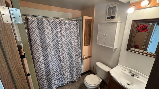 bathroom with toilet, vanity, curtained shower, and tile patterned flooring