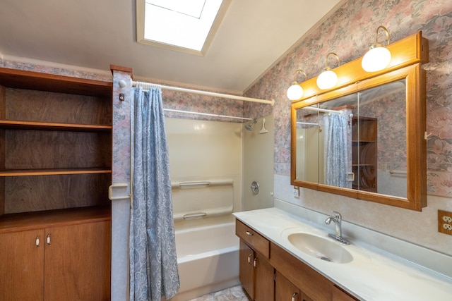 bathroom featuring shower / tub combo, vanity, and wallpapered walls