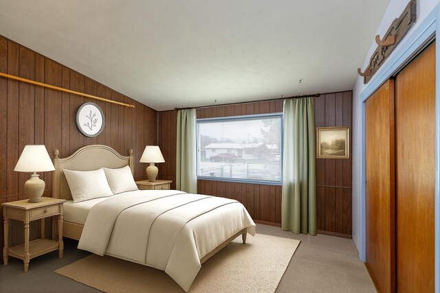 bedroom featuring wooden walls, multiple windows, light colored carpet, and lofted ceiling