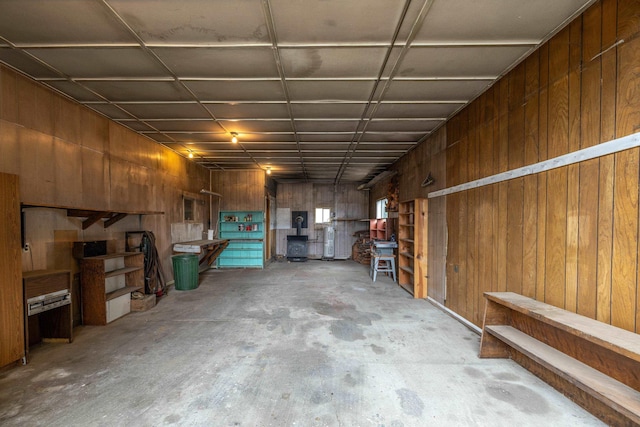 basement featuring wood walls