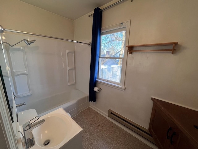 full bathroom with a sink, shower / washtub combination, baseboards, and a baseboard radiator