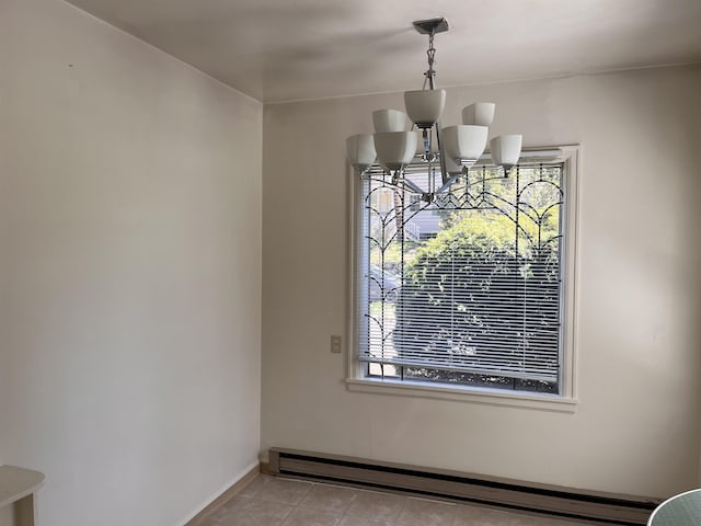 interior space with baseboard heating, baseboards, a notable chandelier, and light tile patterned flooring