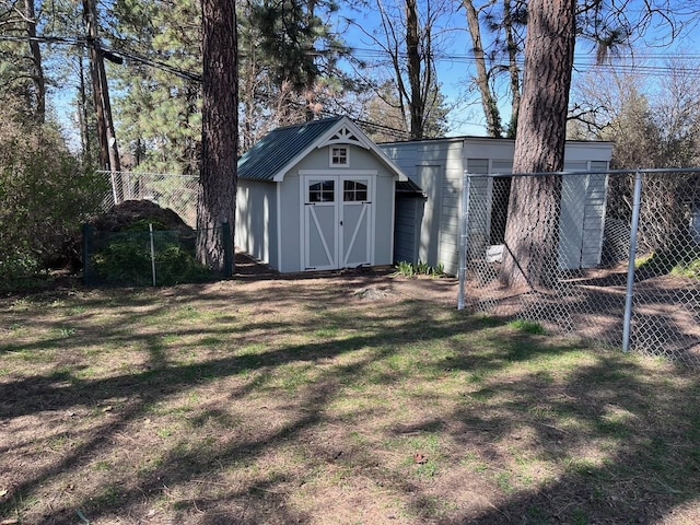 view of shed with fence