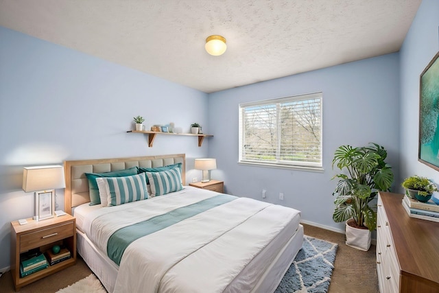 carpeted bedroom featuring baseboards