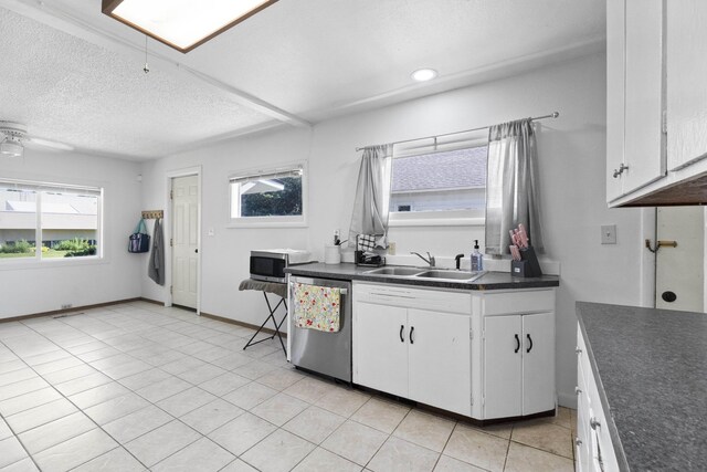 2218 E Hartson Ave, Spokane, WA 99202 - washroom featuring washer / dryer and a textured ceiling