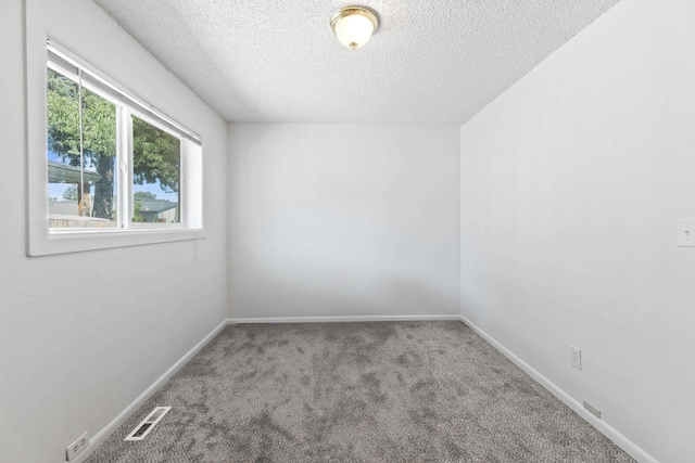 2218 E Hartson Ave, Spokane, WA 99202 - spare room featuring a textured ceiling and carpet flooring